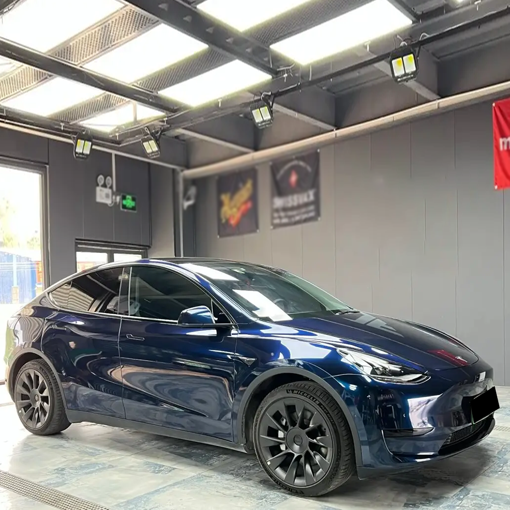 ghost midnight blue car wrap on a tesla model 3