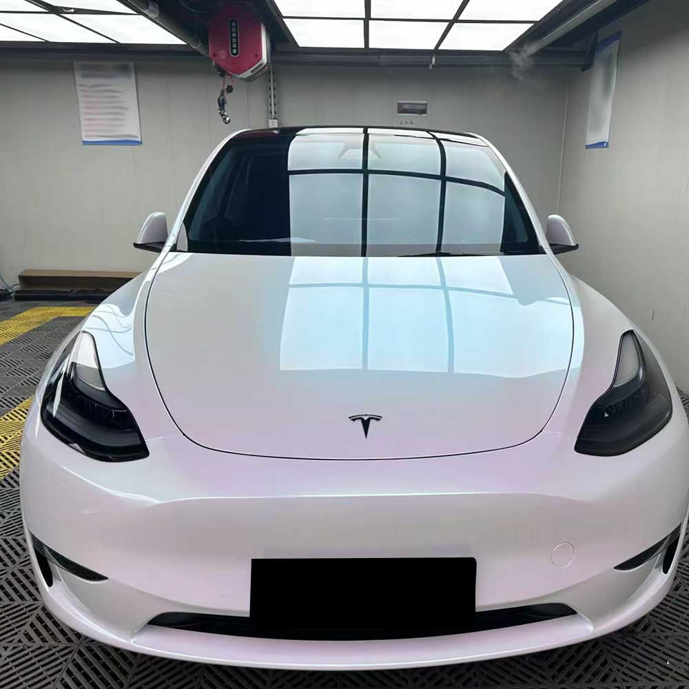 gloss aurora white car wrap installed on a car