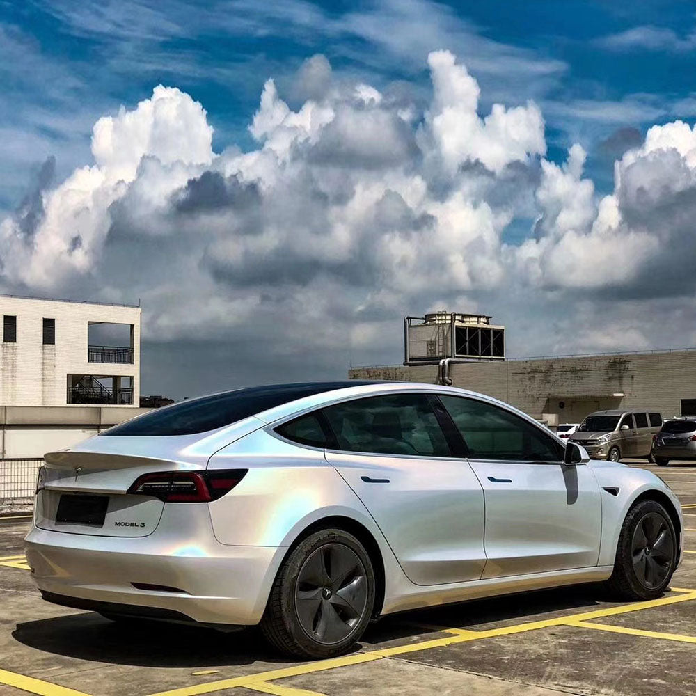 car wrapped in glossy iridescence laser white car wrap