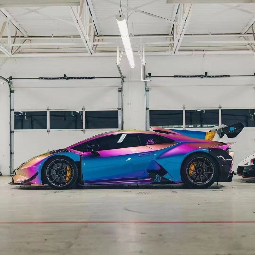 side shot of a car wrapped in magic colored purple car wrap