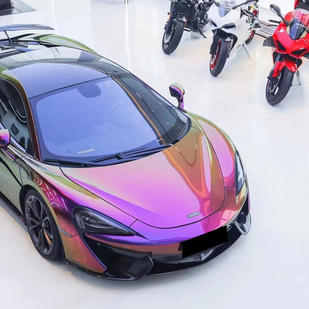 front close up of a car wrapped in magic colored purple car wrap