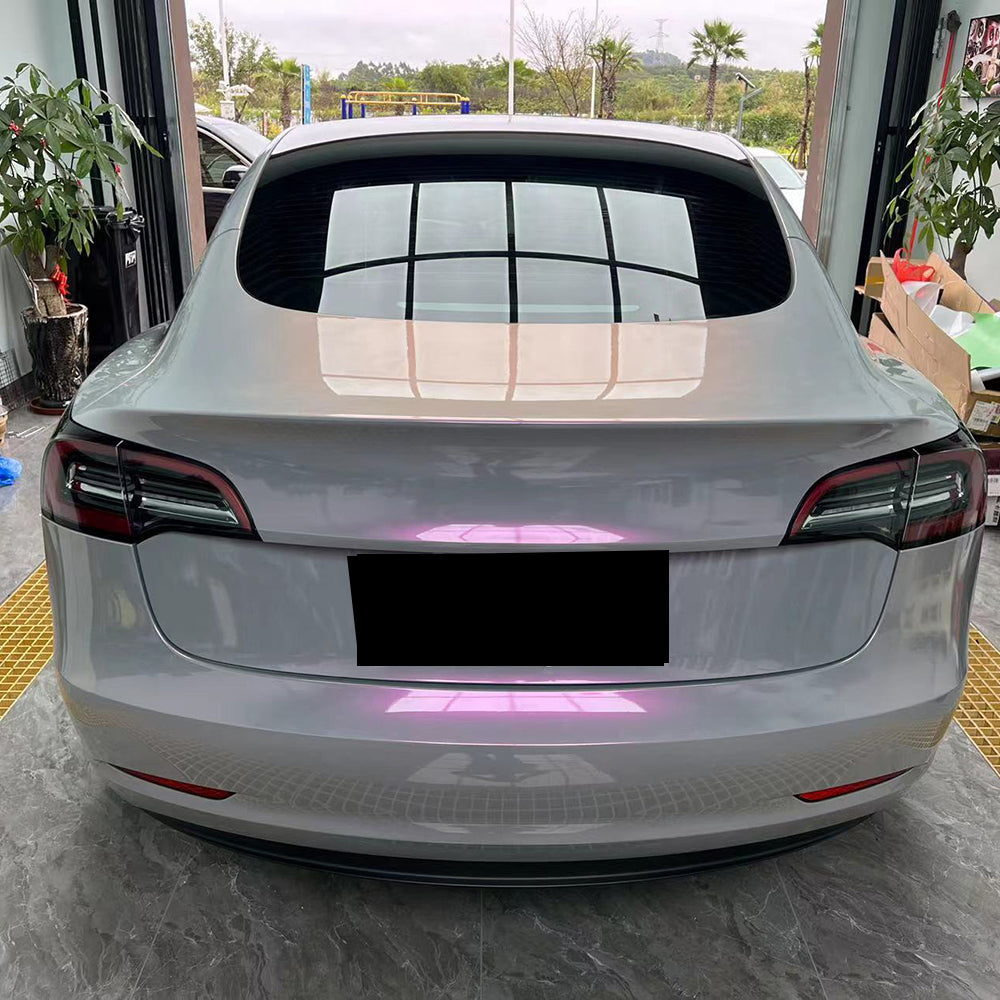 tesla wrapped in twin magic grey pink car wrap