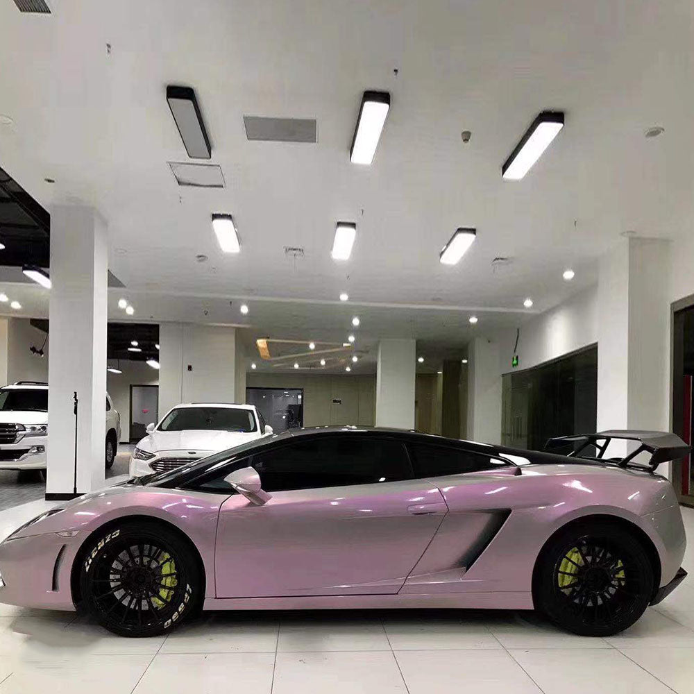 sports car wrapped in twin magic grey pink car wrap