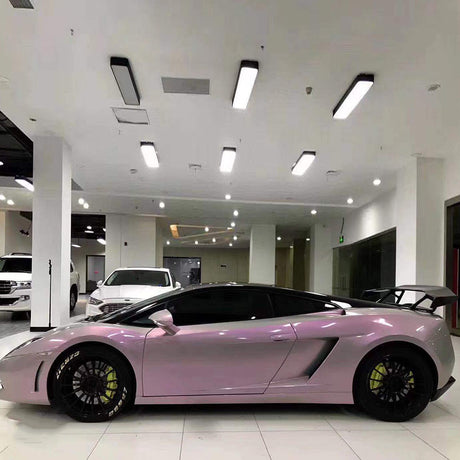 sports car wrapped in twin magic grey pink car wrap