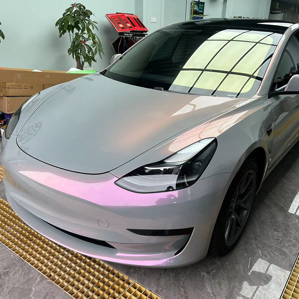 twin magic grey pink car wrap on a tesla