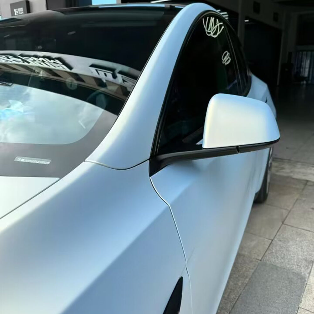close up mirror view of a car wrapped in ultra matte gold blue color changing car wrap