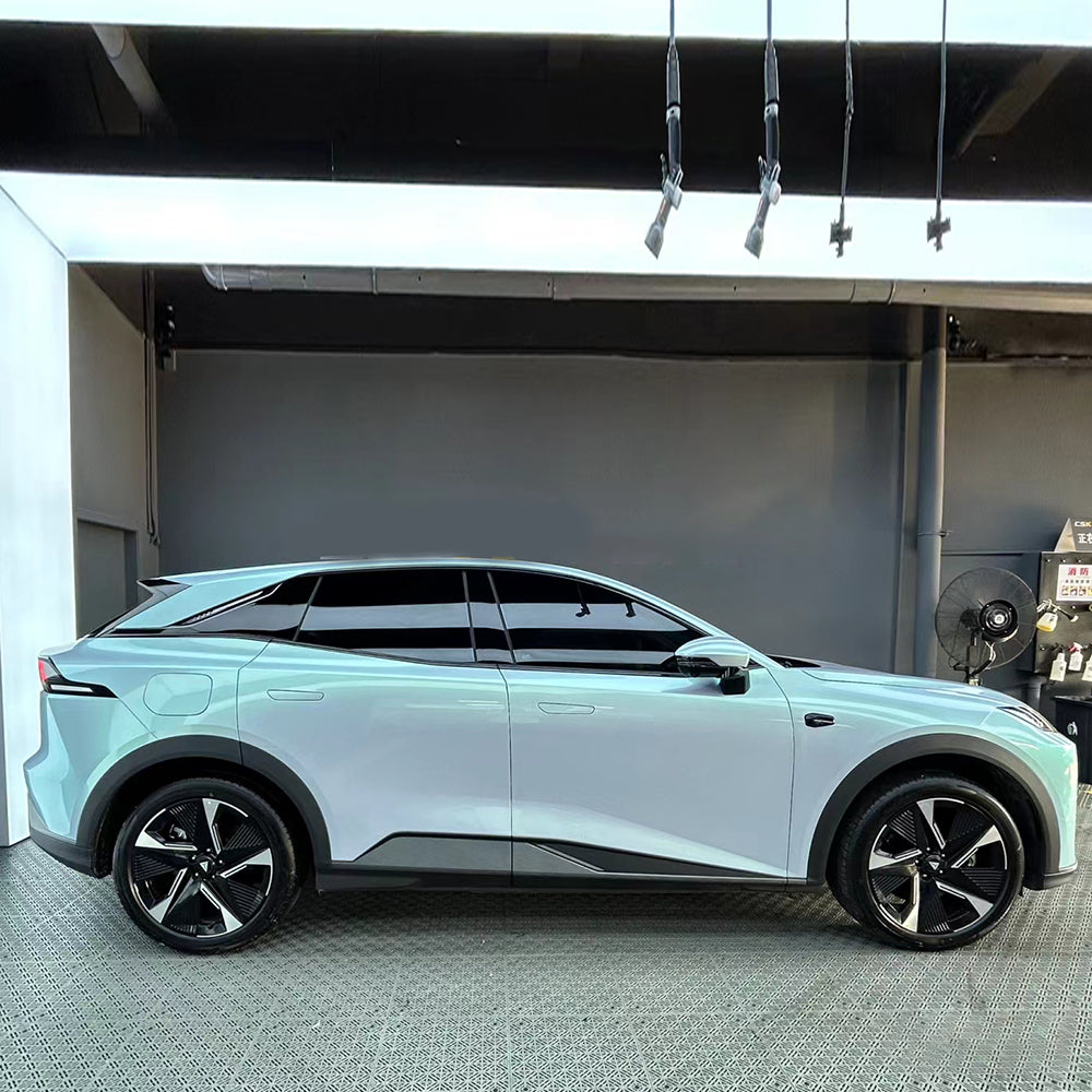 Side shot of a car wrapped in ultra matte gold blue color changing car wrap