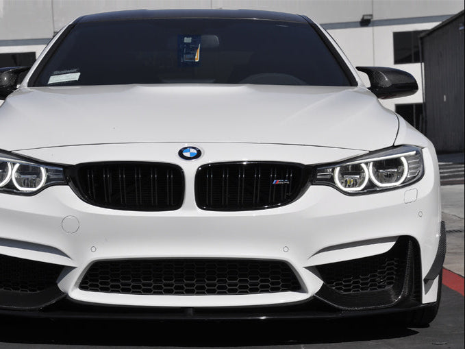 a set of dry carbon fiber canards being shown on bmw f82 m4