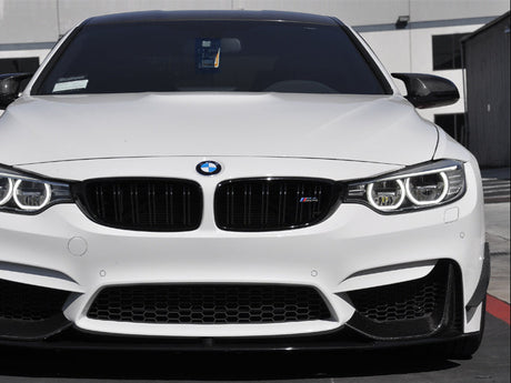 a set of dry carbon fiber canards being shown on bmw f82 m4