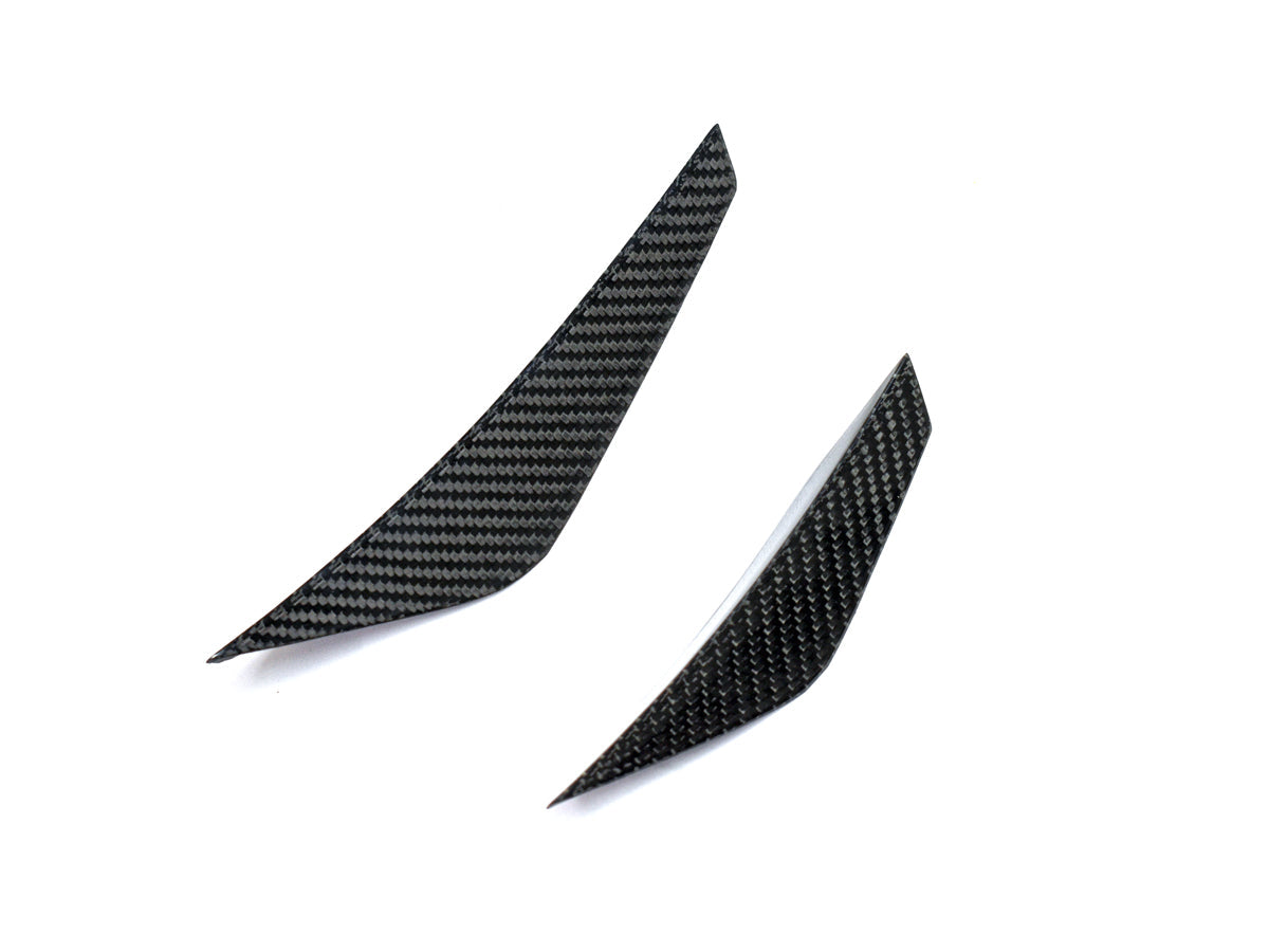 close up shot of dry carbon fiber canard set by autotecknic for g8x bmw