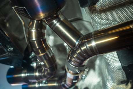 valvetronic designs titanium exhaust system installed on a f90 bmw m5