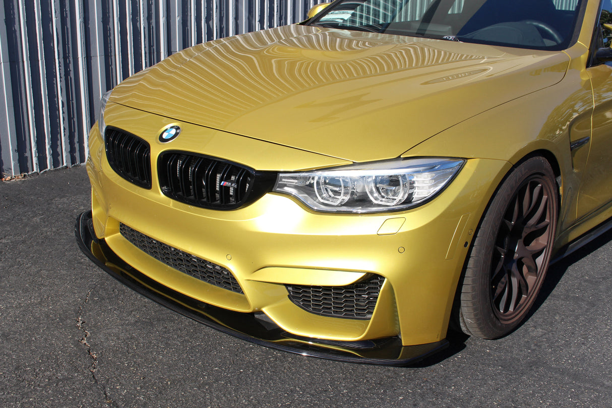 f82 bmw m4 with a carbon fiber front lip by apr performance