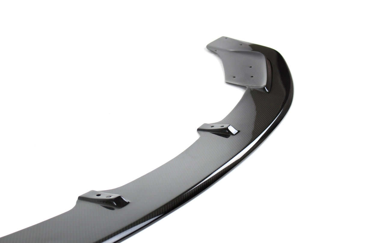 close up of carbon fiber front lip by apr performance for bmw f80 m3 and f82 m4