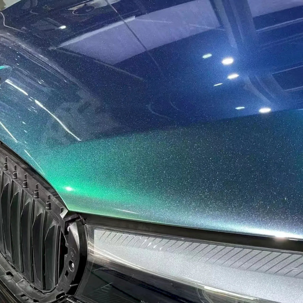 diamond blueish green aurora gloss car wrap installed on a vehicle
