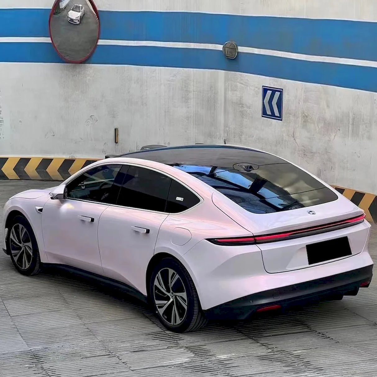 diamond pollen sparkling pink car wrap with gold flakes installed on a vehicle
