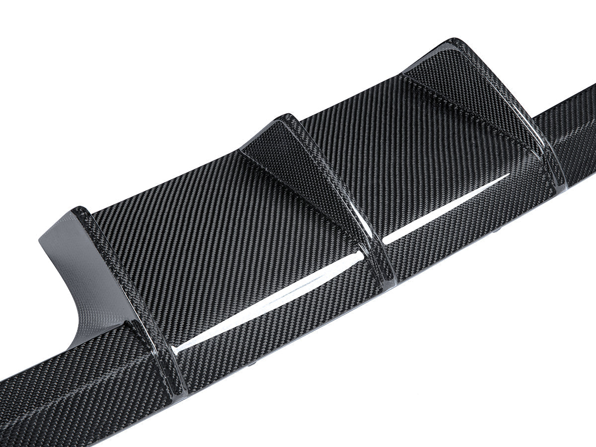 close up look at dry carbon fiber motorsport rear diffuser for bmw m3 g80 g81 by autotecknic