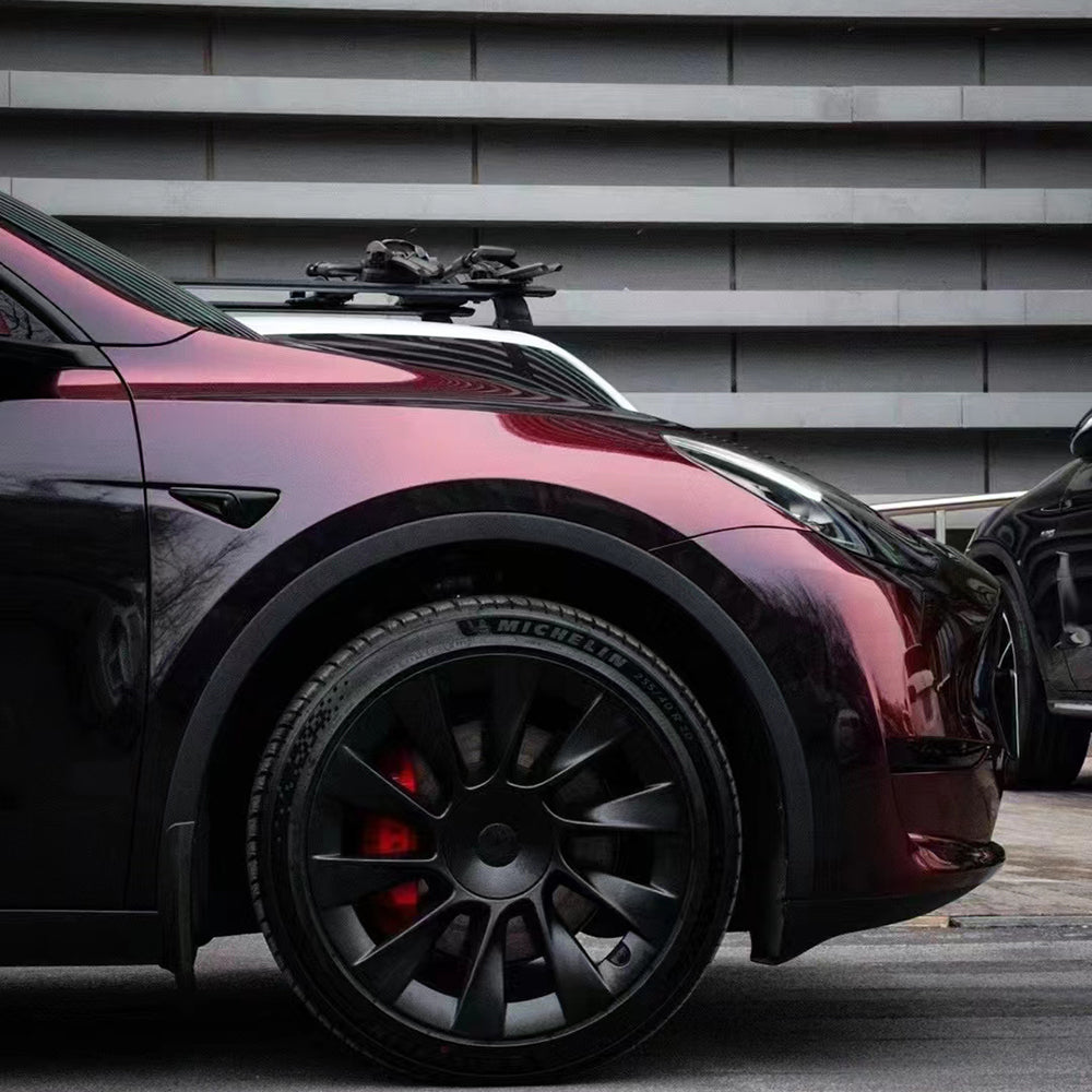 close up shot of a front of a car wrapped in flowing phantom red car wrap vinyl
