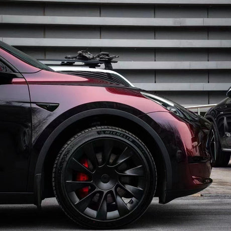 close up shot of a front of a car wrapped in flowing phantom red car wrap vinyl