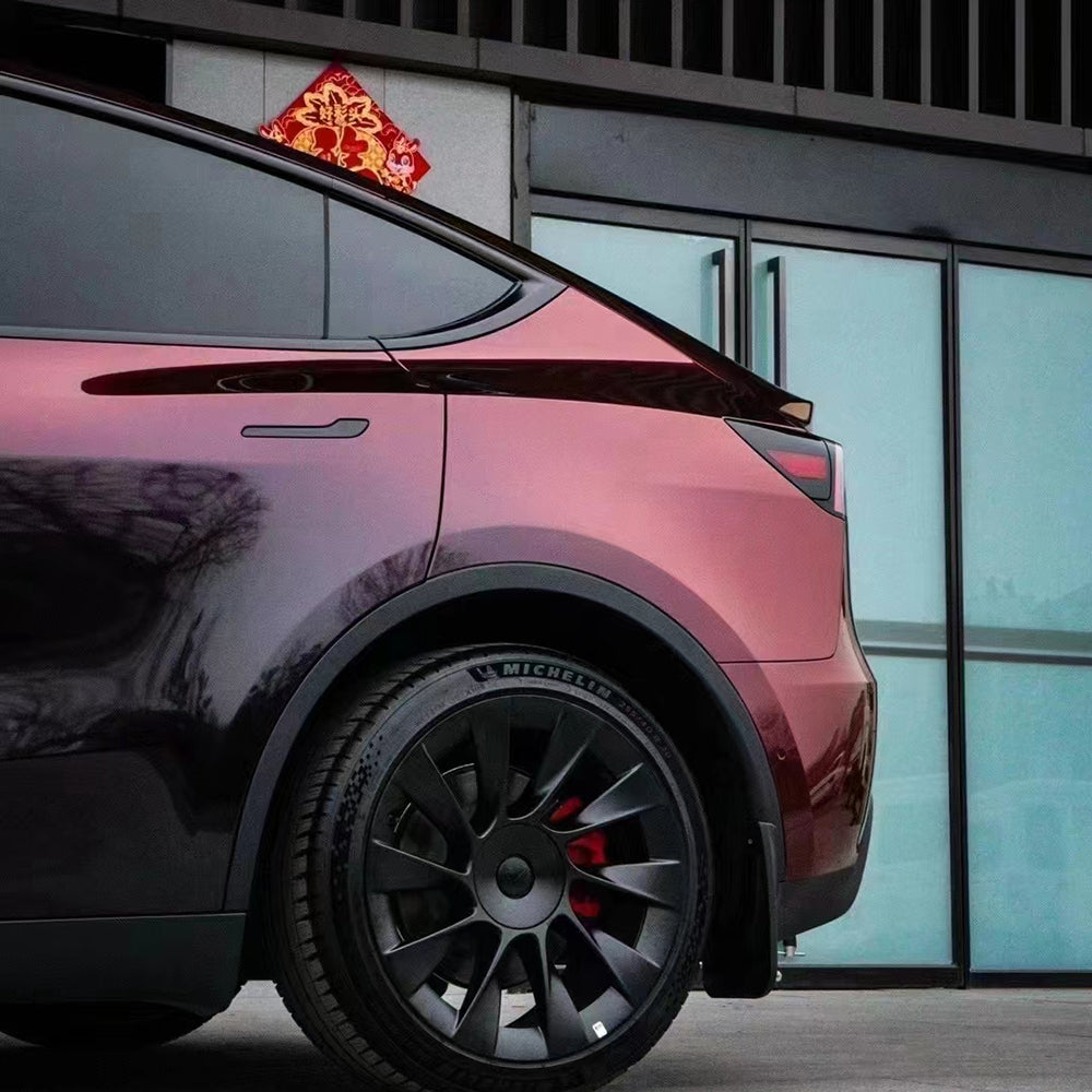 rear quarter panel shot of a car wrapped in flowing phantom red car wrap vinyl
