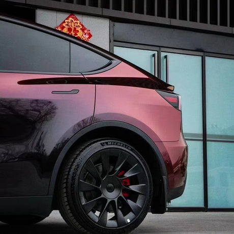 rear quarter panel shot of a car wrapped in flowing phantom red car wrap vinyl
