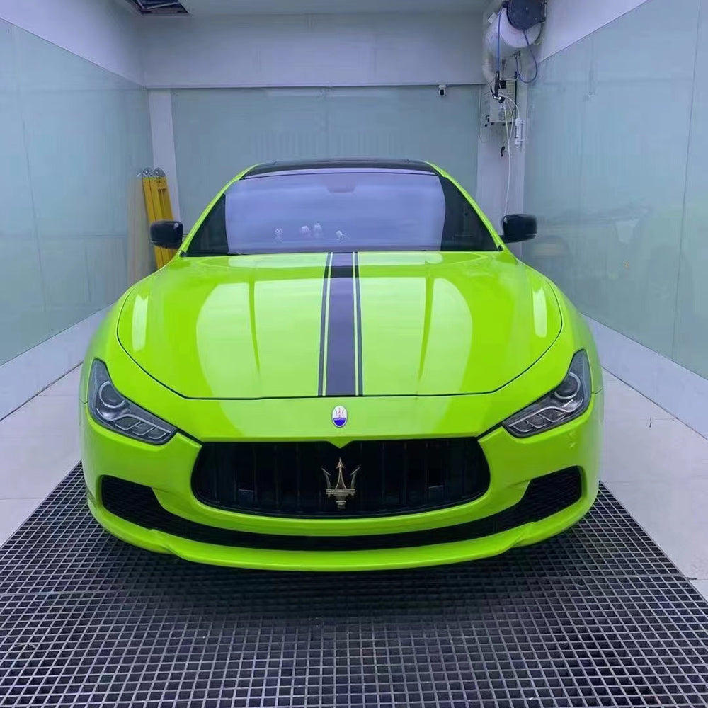 sedan wrapped in gloss apple green car wrap