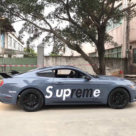 gloss cement gray car wrap on a car