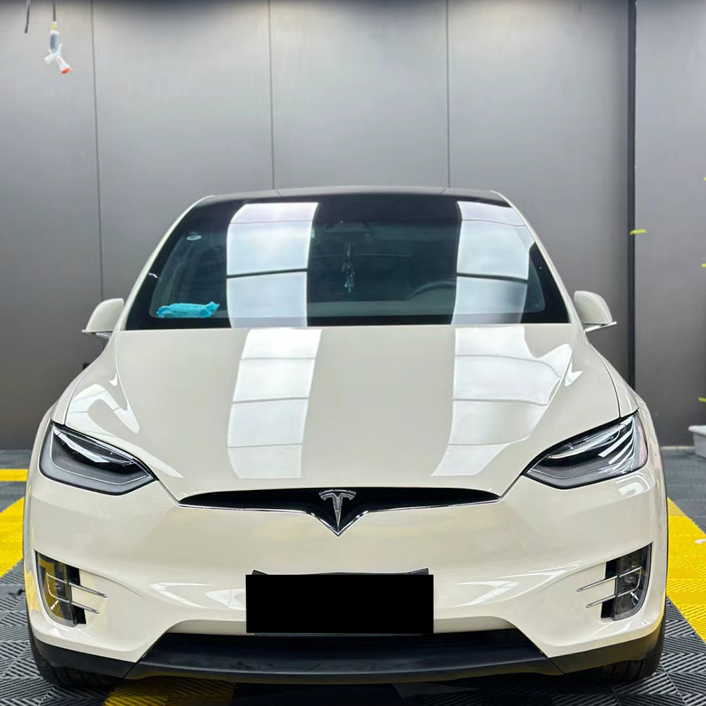 gloss coopers white car wrap installed on a car