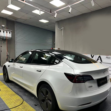 tesla getting wrapped in gloss crescent white car wrap