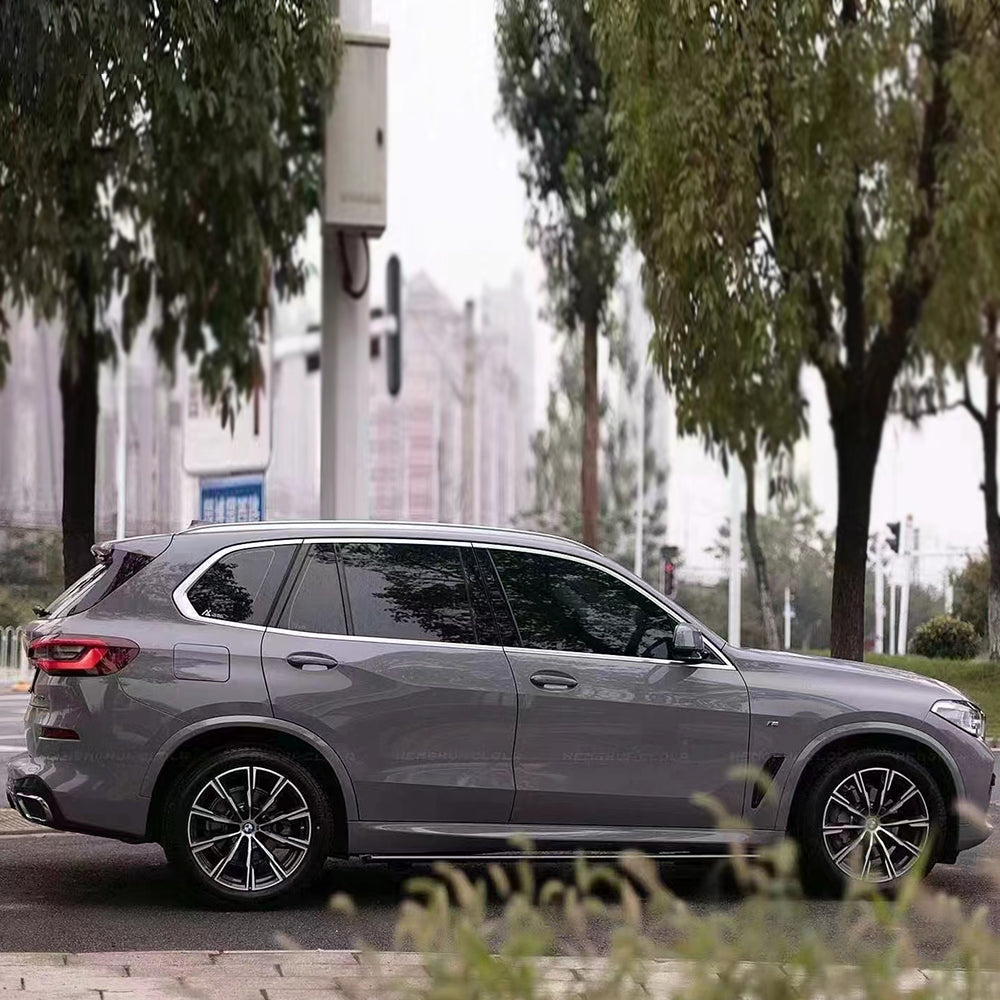 side angle of the gloss dark nado gray car wrap that's installed on a vehicle