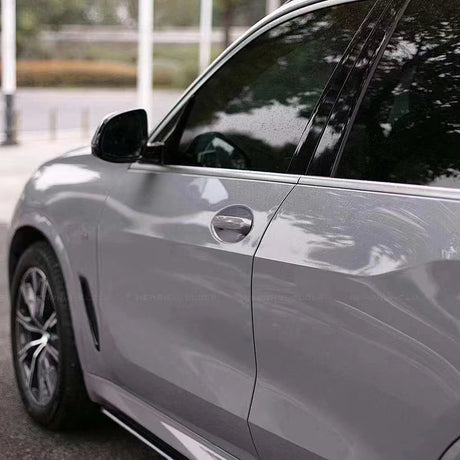 close up of gloss dark nado gray car wrap