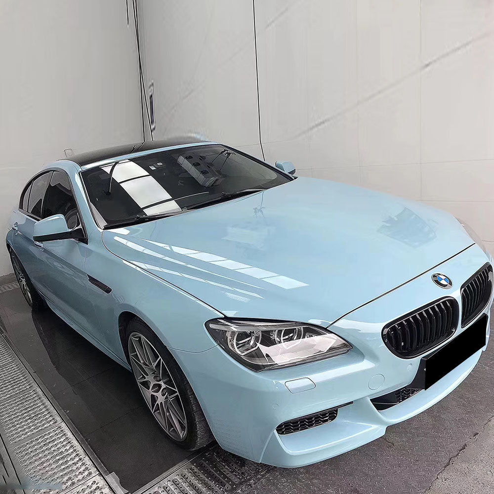 sports car wrapped in gloss ice blue car wrap