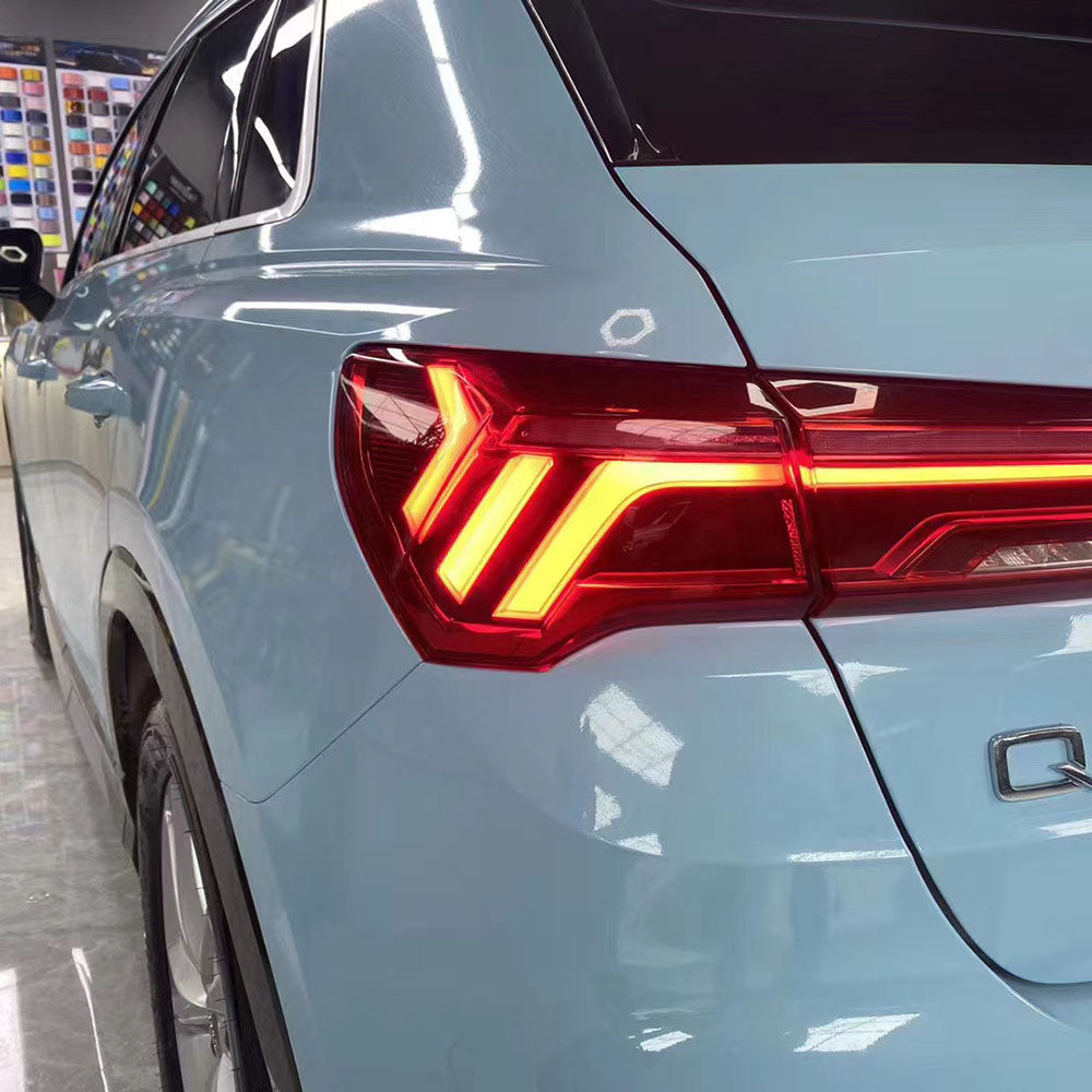 close up of gloss light blue car wrap