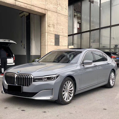 gloss light cement gray car wrap installed on a vehicle