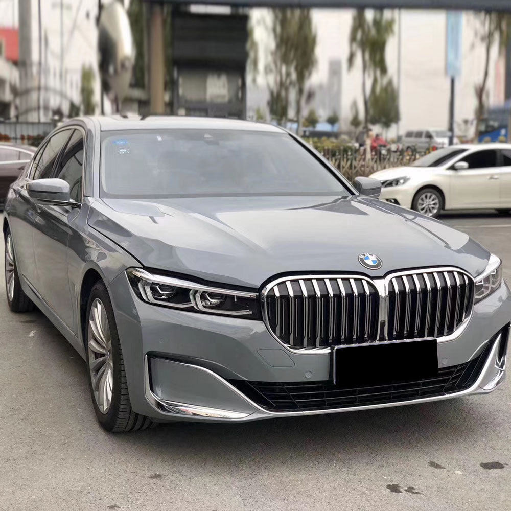 sedan wrapped in gloss light cement gray car wrap