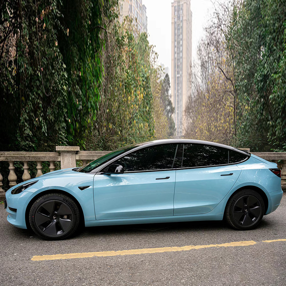 side profile of a car wrapped in gloss mesisen blue car wrap