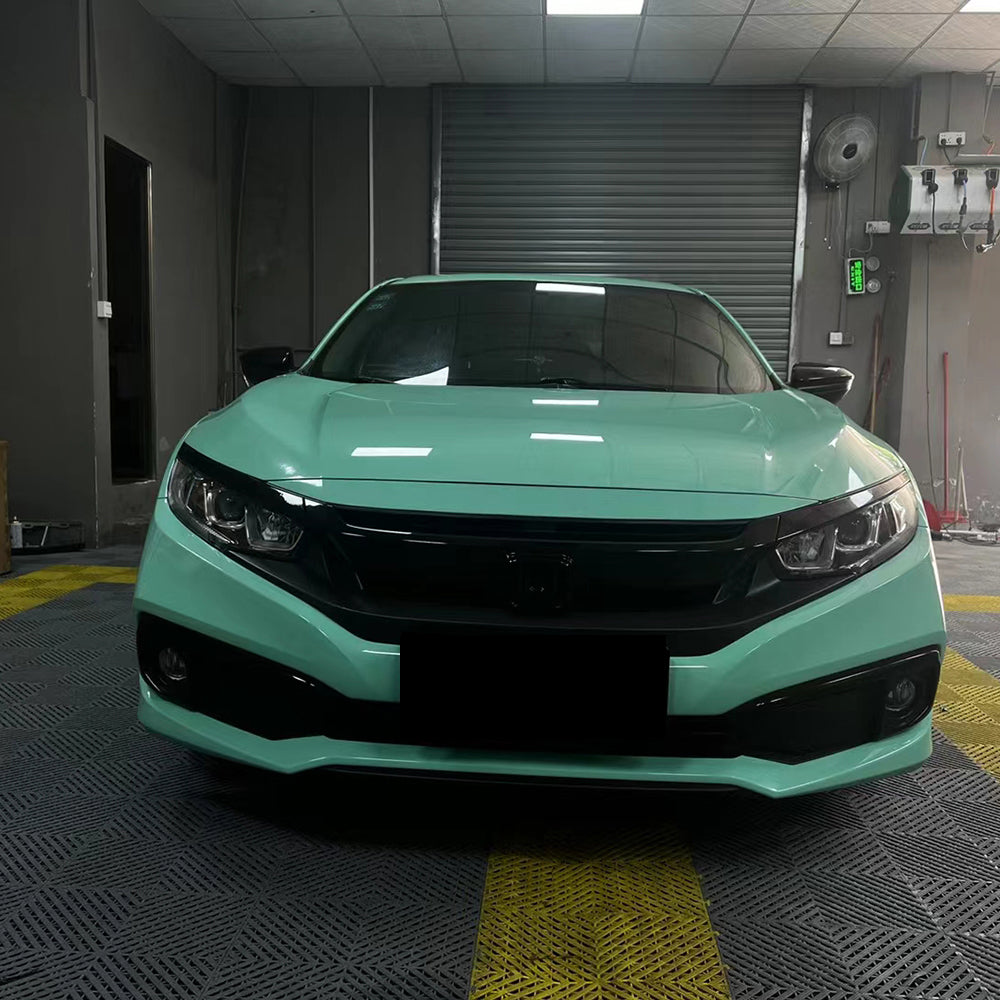 gloss mint green car wrap installed on a vehicle