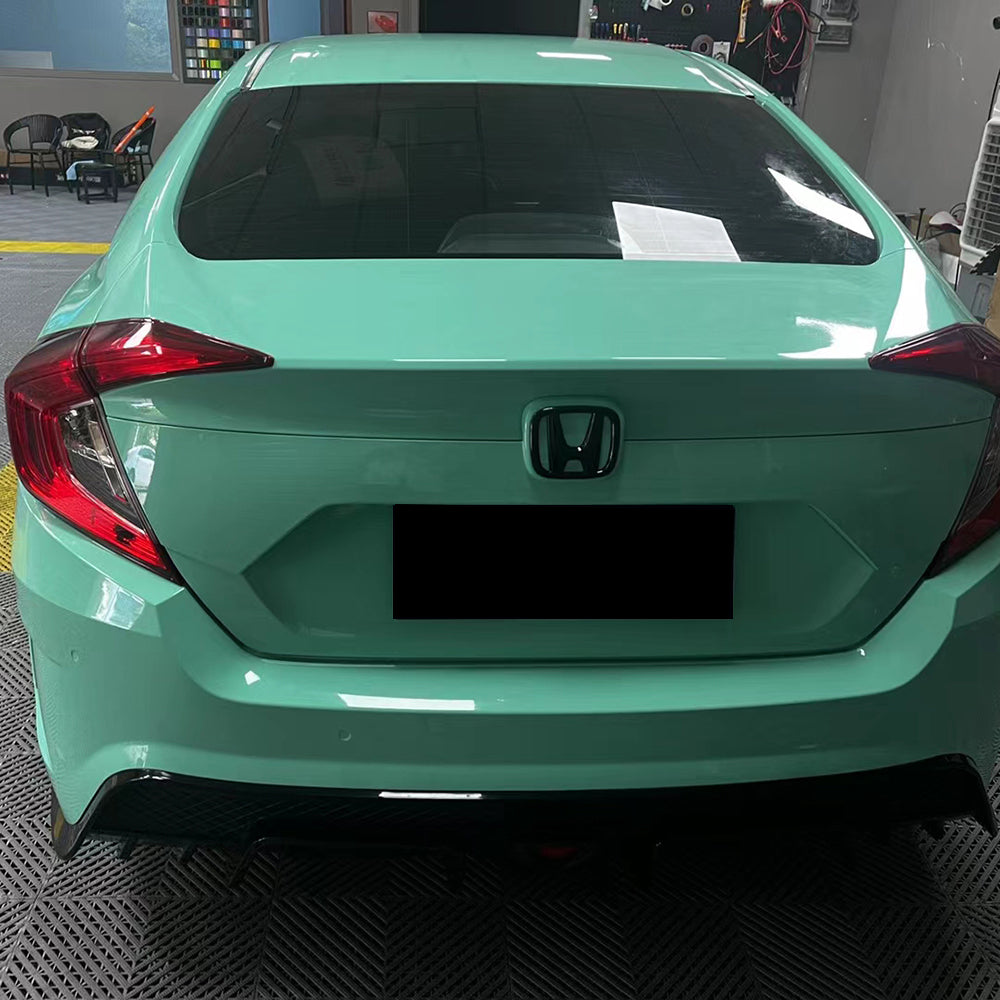 close up shot of gloss mint green car wrap