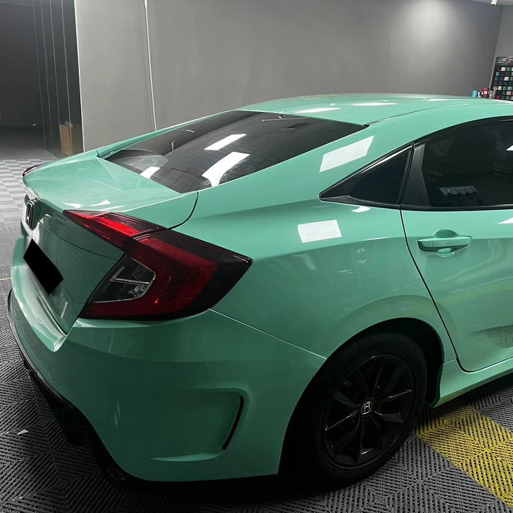 car wrapped in gloss mint green car wrap