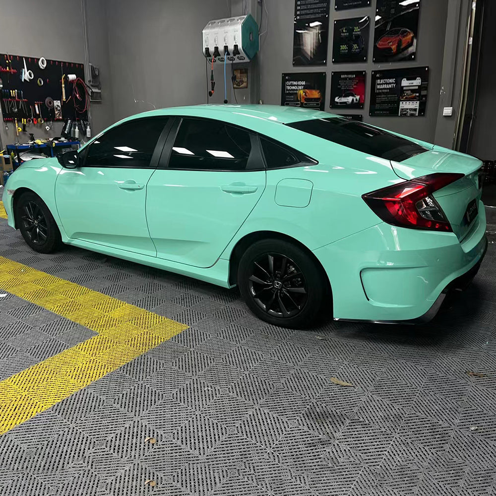 side profile of a car wrapped in gloss mint green car wrap