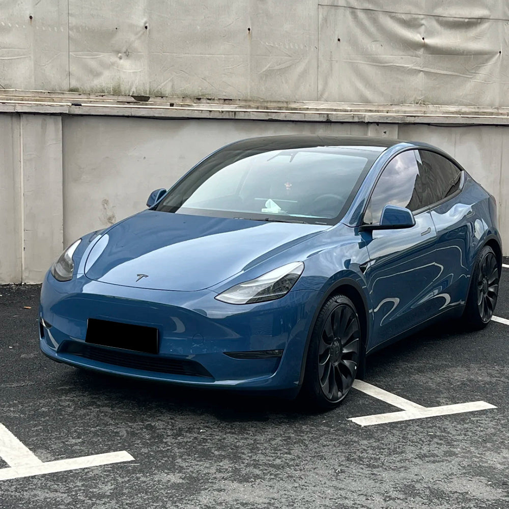 gloss neptune blue car wrap installed on a car