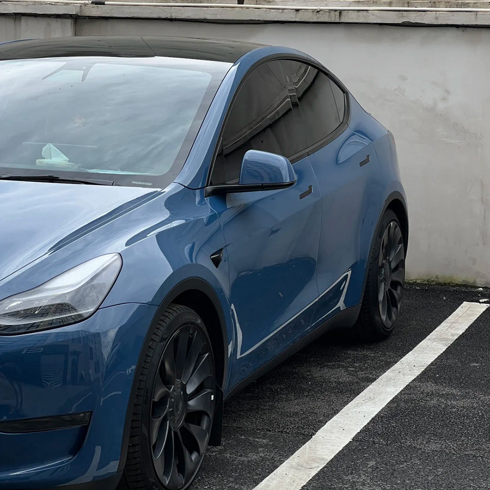 side shot of a car wrapped in gloss neptune blue car wrap