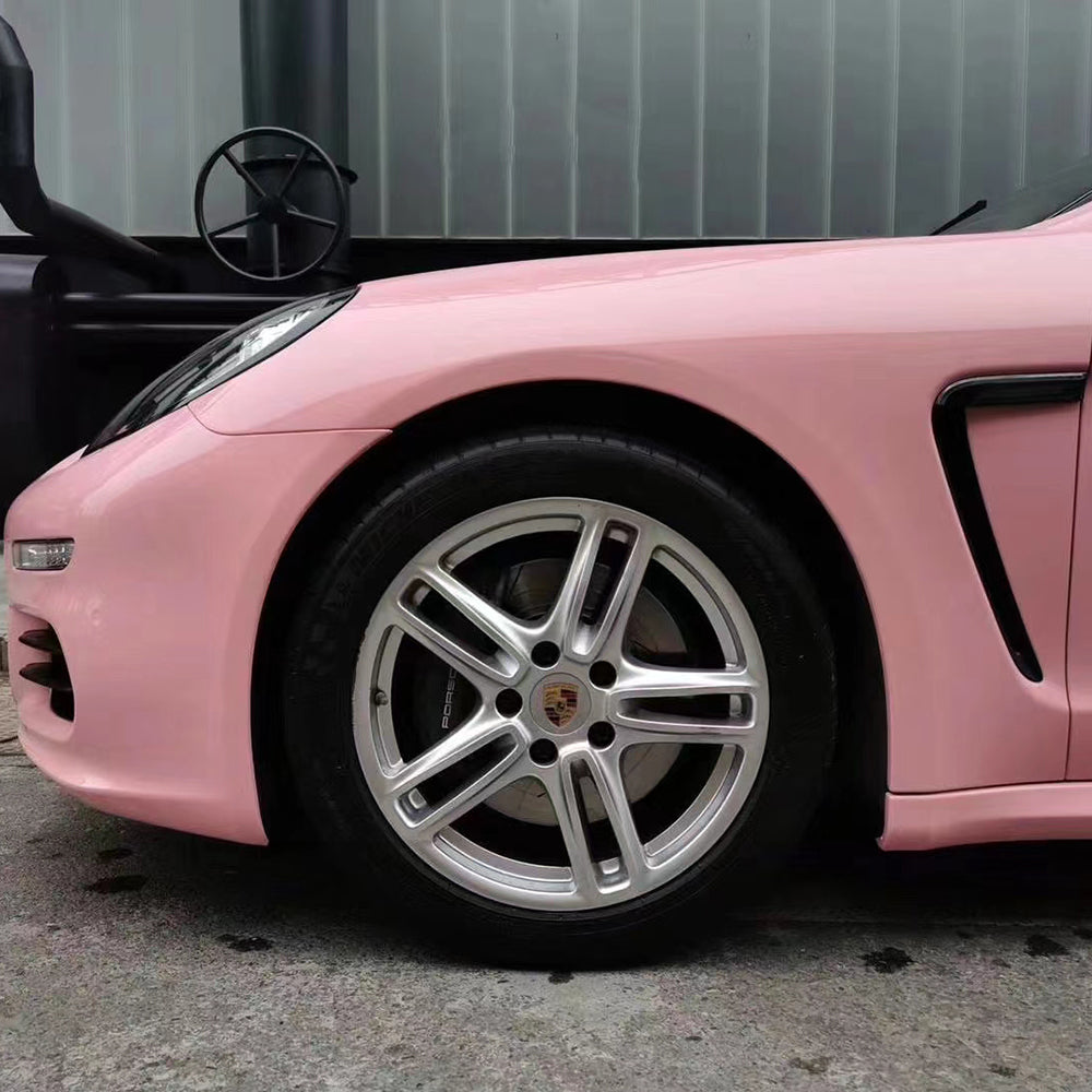 gloss pink red car wrap on the front of a sports hatchback