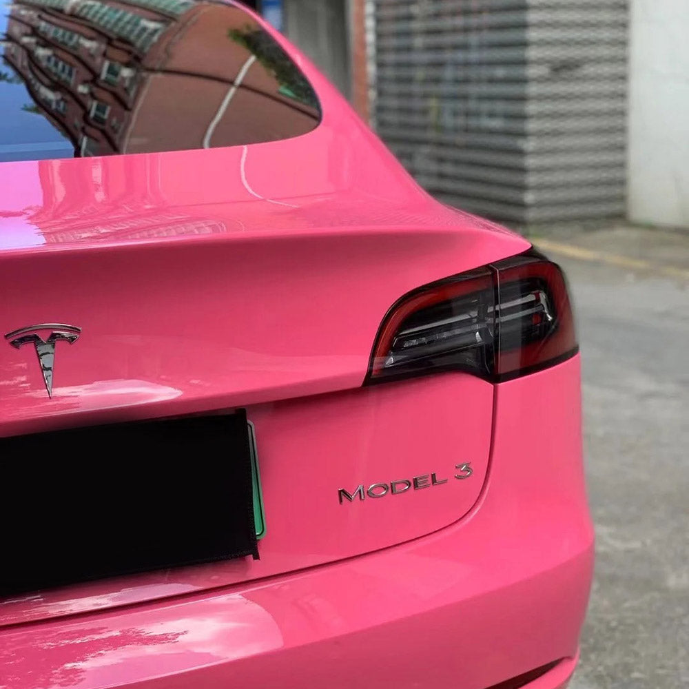 rear of a car that's wrapped with gloss princess pink car wrap