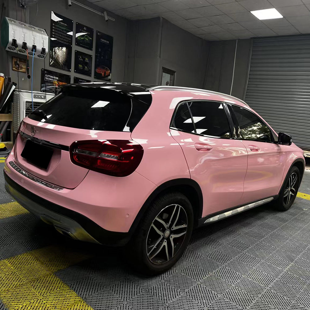 small SUV wrapped in gloss rouge pink car wrap
