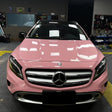 close up look of gloss rouge pink car wrap