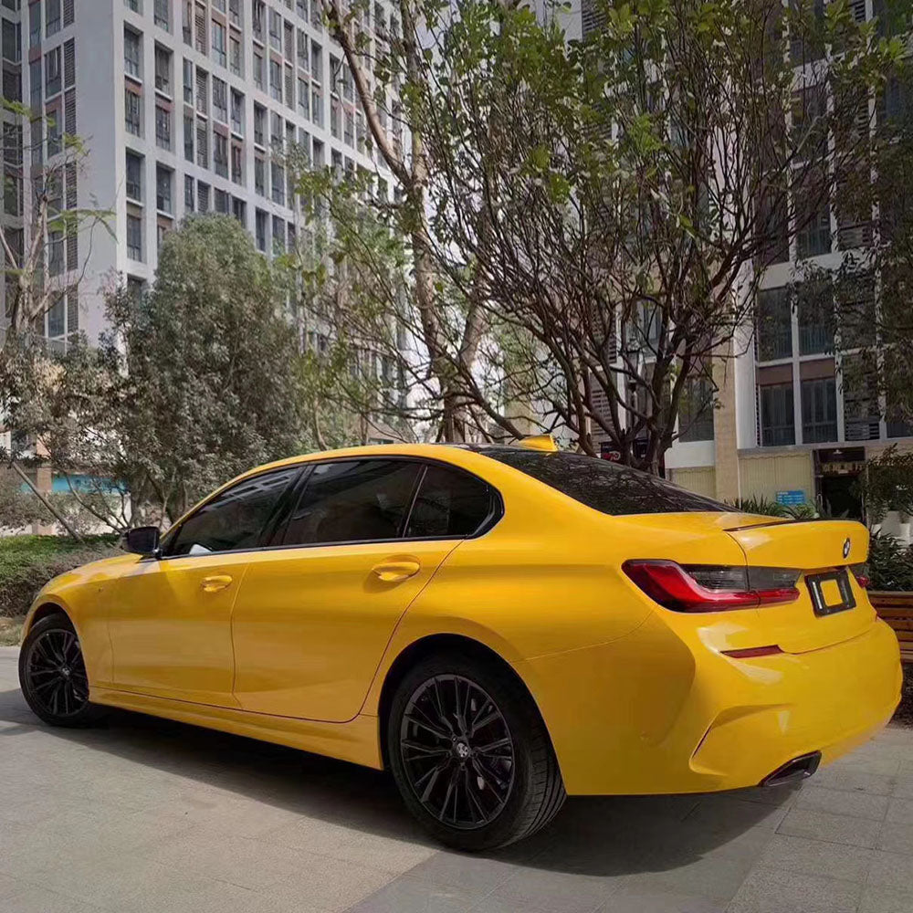 gloss sunflower yellow car wrap on a vehicle