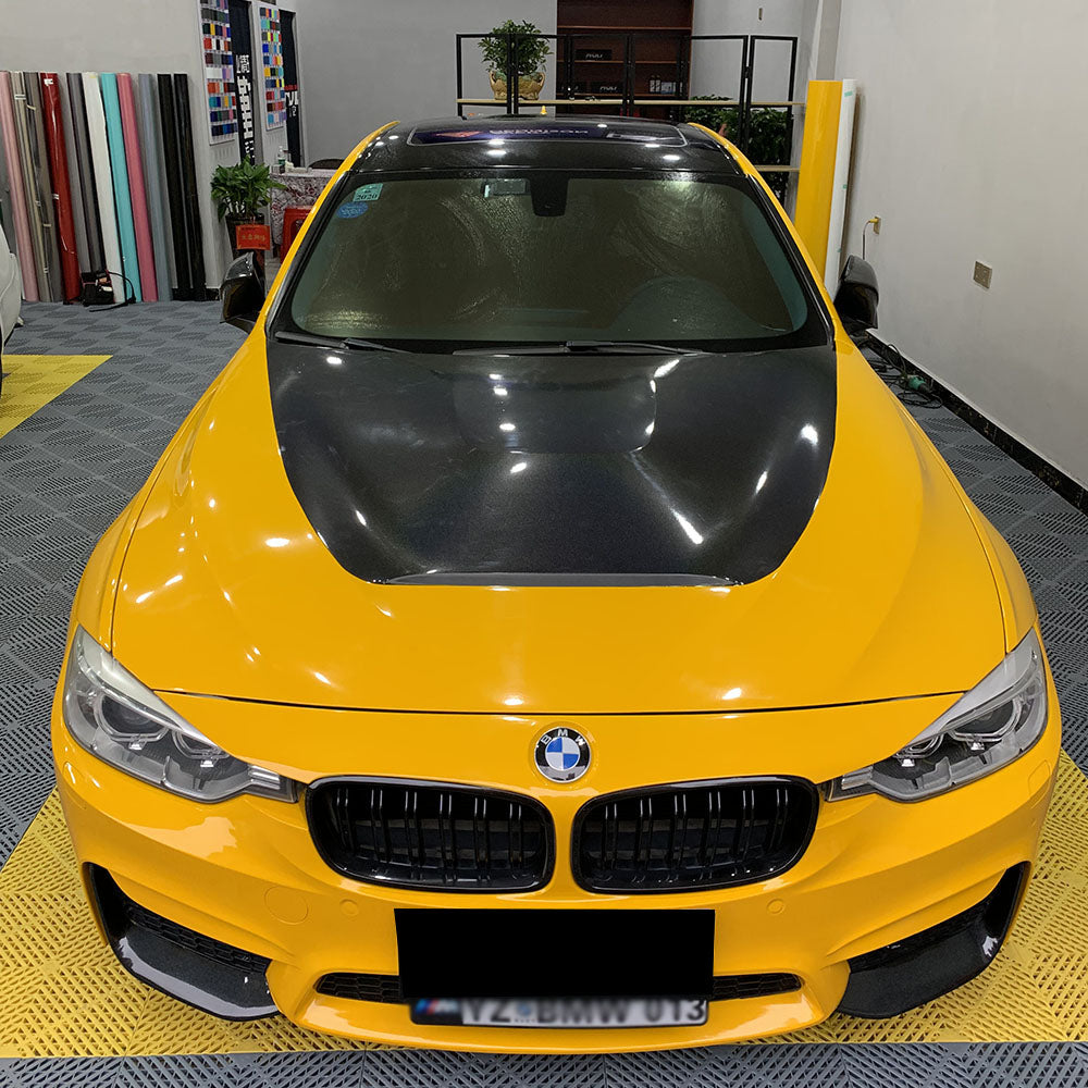 gloss sunflower yellow car wrap being installed