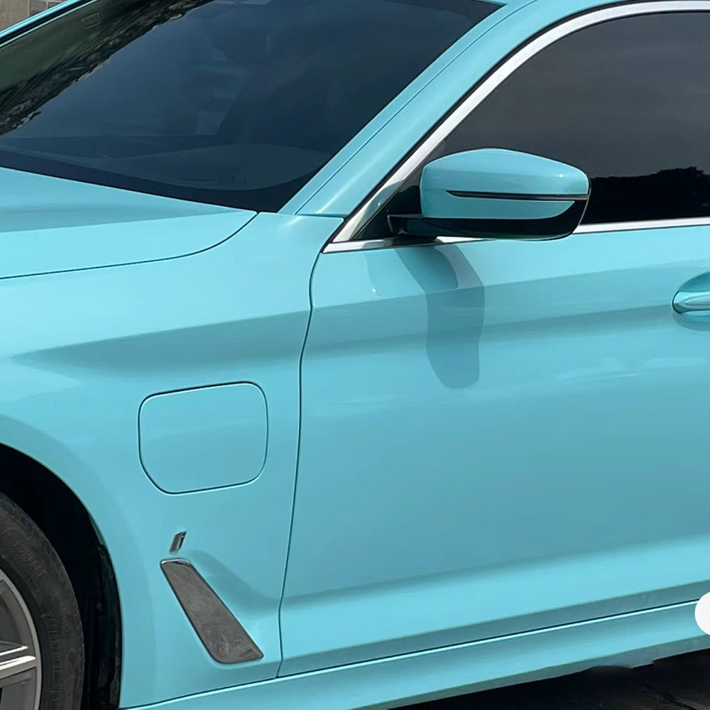 close up shot of gloss tanager blue car wrap