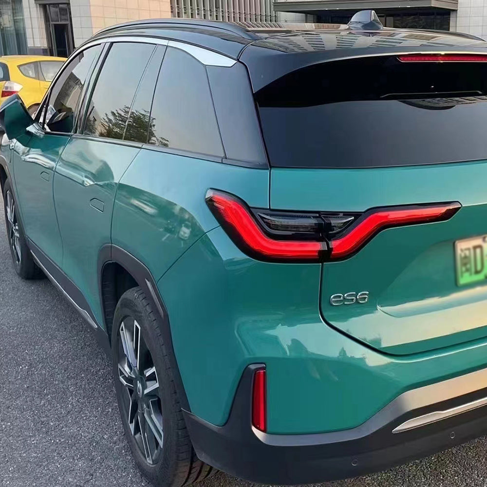 gloss windstorm green car wrap on a car