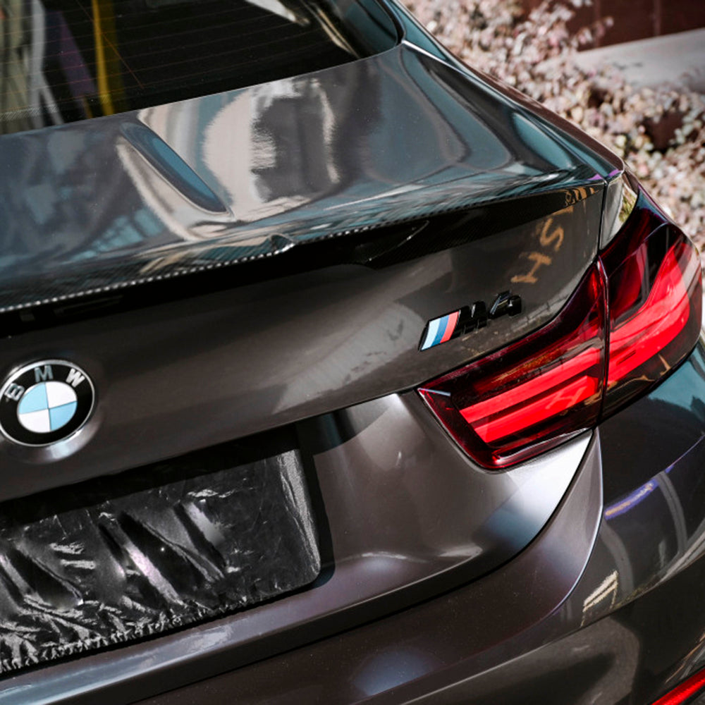 close up look of a bmw wrapped in liquid agate gray car wrap